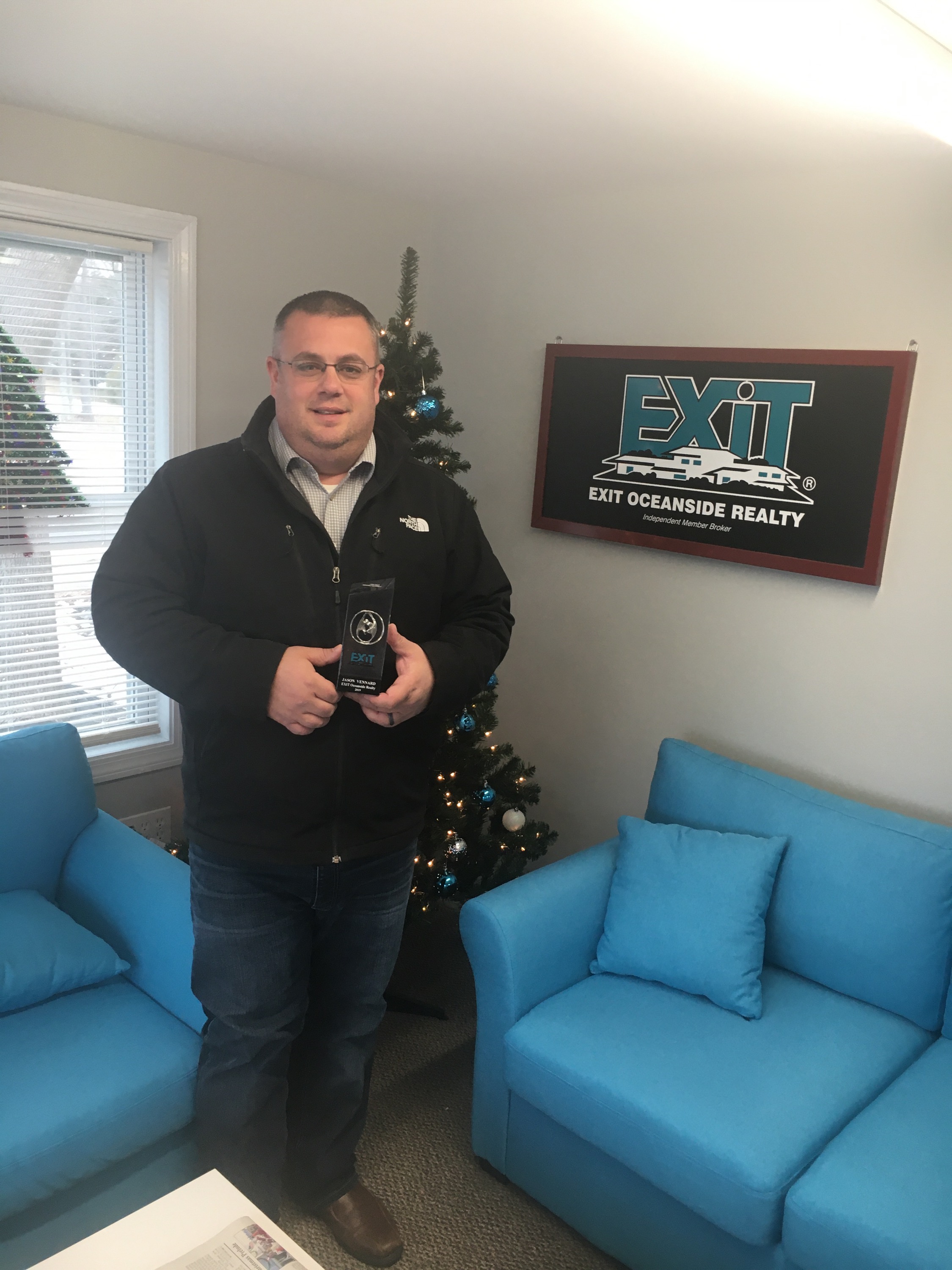 Jason Vennard receives the Silver Award from Exit Realty Corp. International