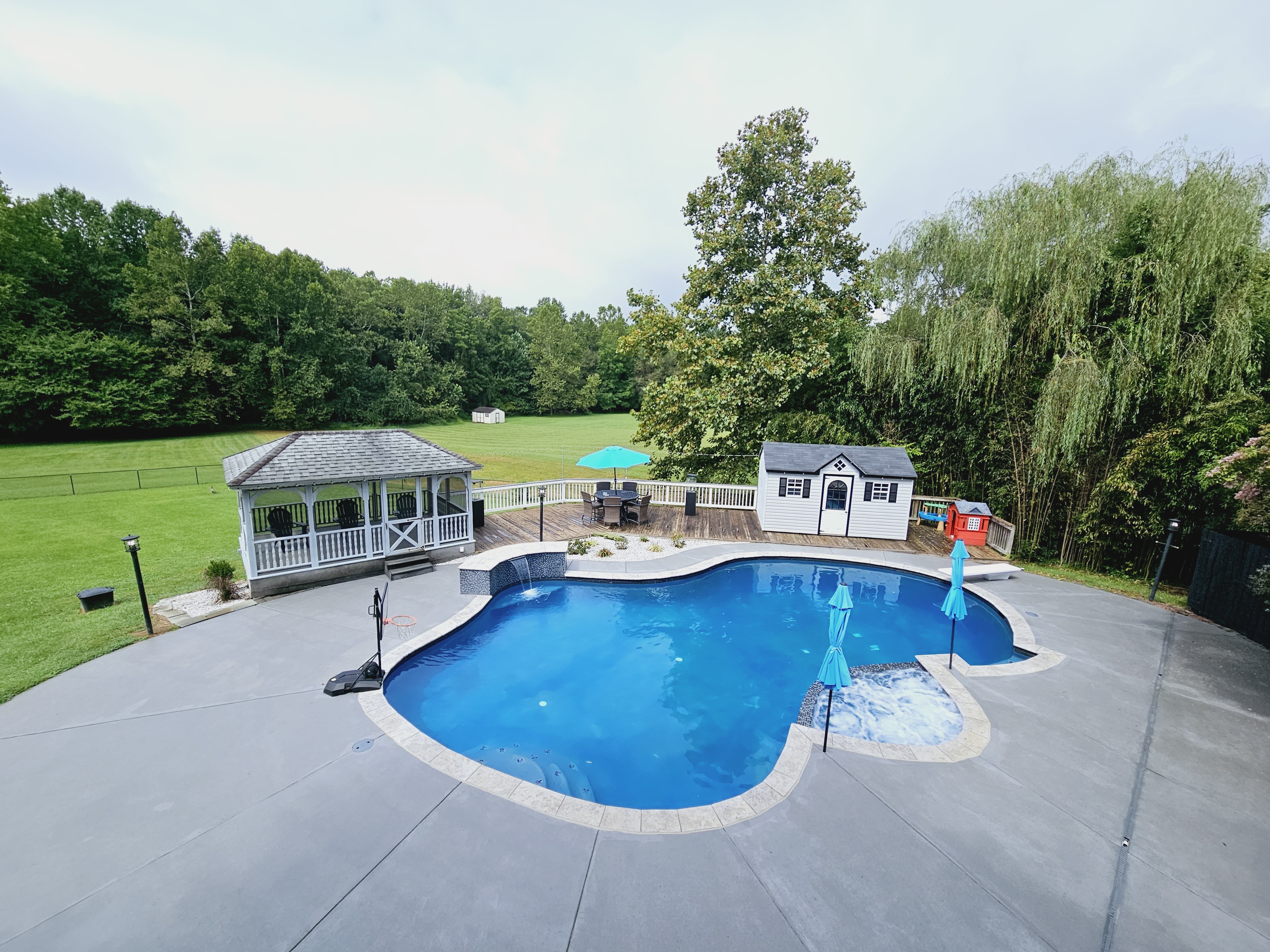 The property has a and the cement around the pool and front walkway has been textured and colored to add appeal and anti-slip protection. 